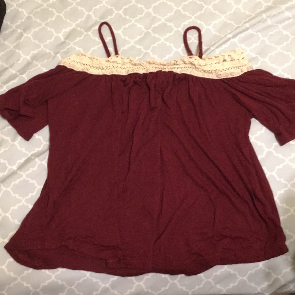 I am selling a maroon and cream color top.